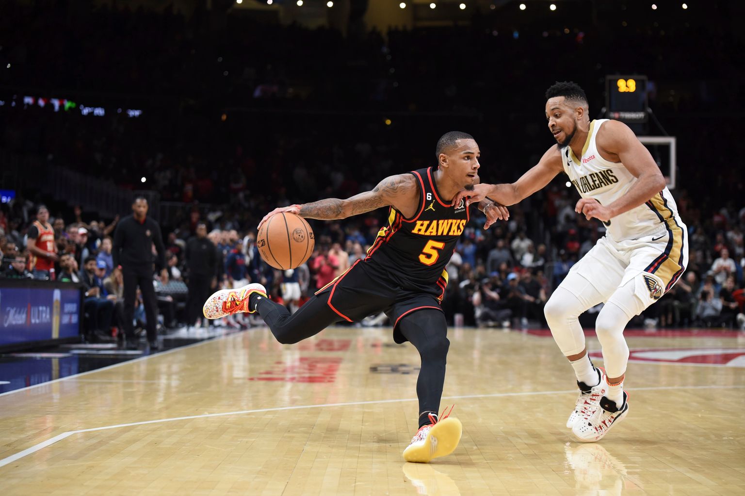Atlanta Hawks’ Dejounte Murray, left, drives past New Orleans Pelicans’ CJ McCollum during the second half of an NBA basketball game Saturday, Nov. 5, 2022, in Atlanta. (AP Photo/Hakim Wright Sr.)